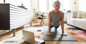woman practicing virtual yoga